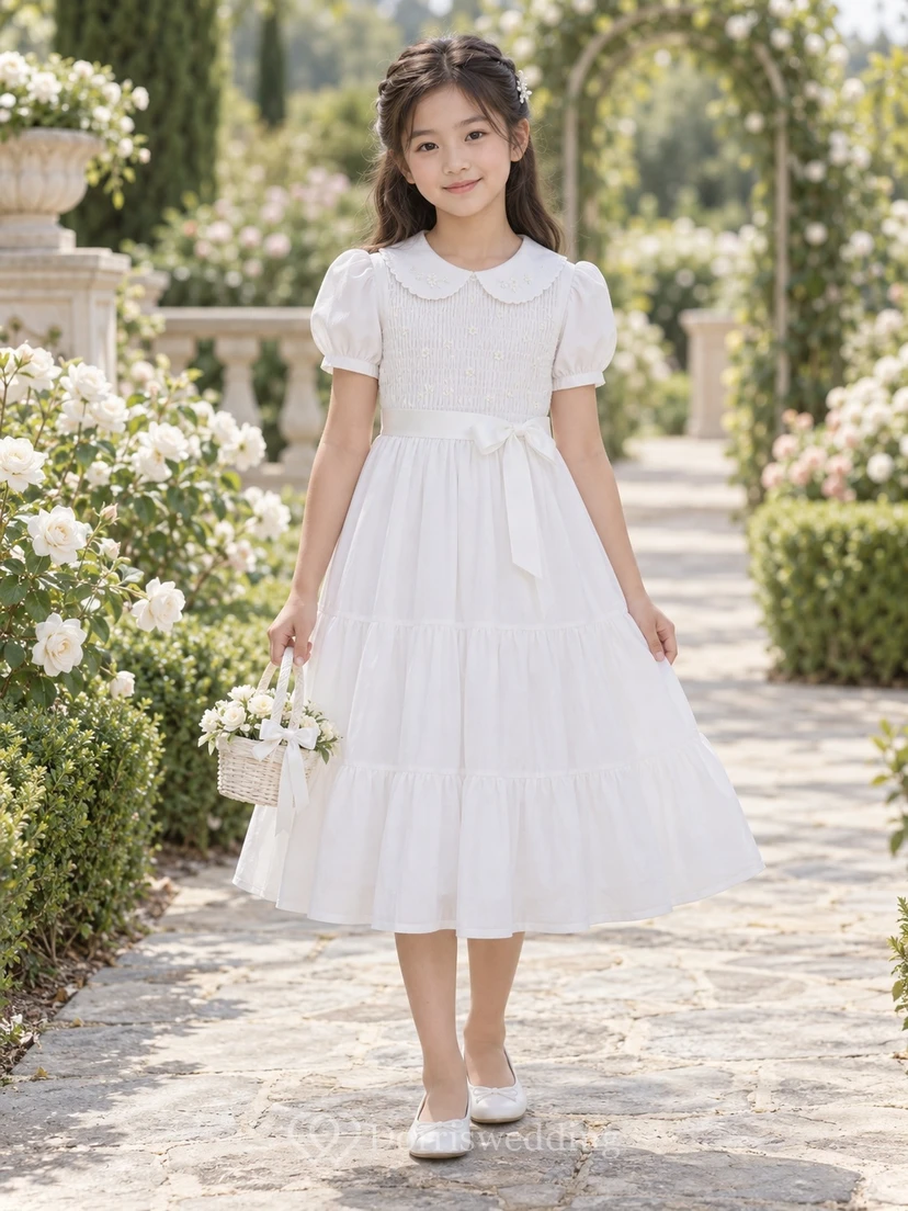 Vestido de niña de flores blanco vintage de corte A con mangas abullonadas, escote en V, lazo en la cintura y cuello Peter Pan, hasta la rodilla.
