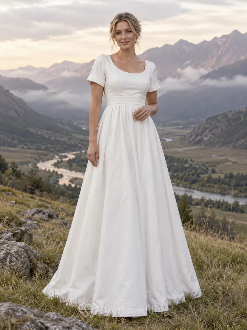 Vestido de novia de popelina de algodón estilo campestre, corte en A, escote redondo y mangas cortas con puños.