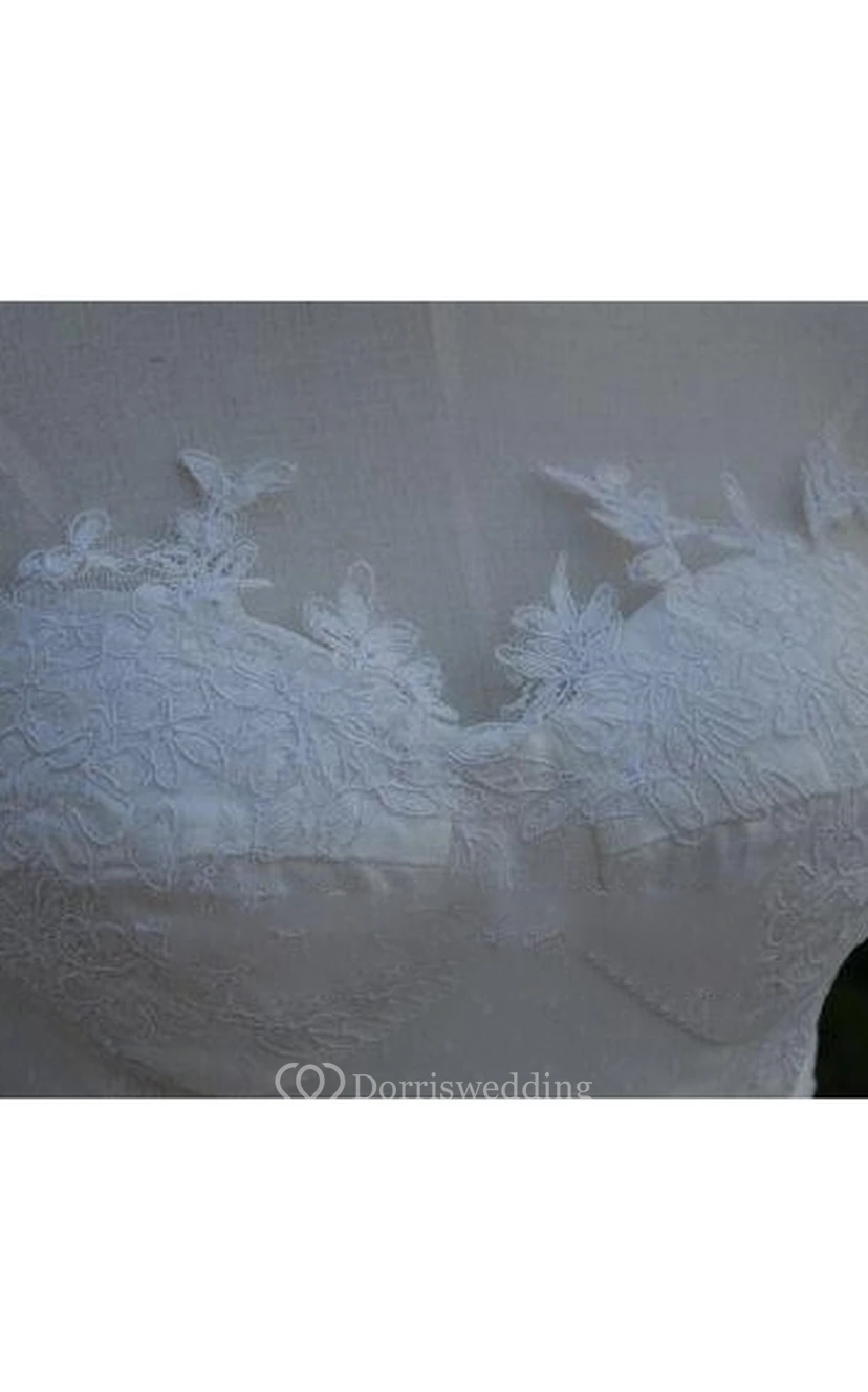Robe de mariée en mousseline à dos lacé et décolleté asymétrique, ornée de volants et de superpositions view 9