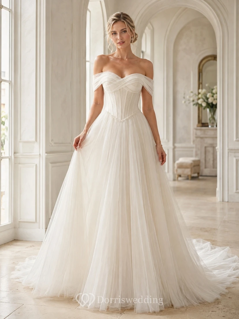 Vestido de novia de tul con corte en A y hombros descubiertos y cintura baja.
