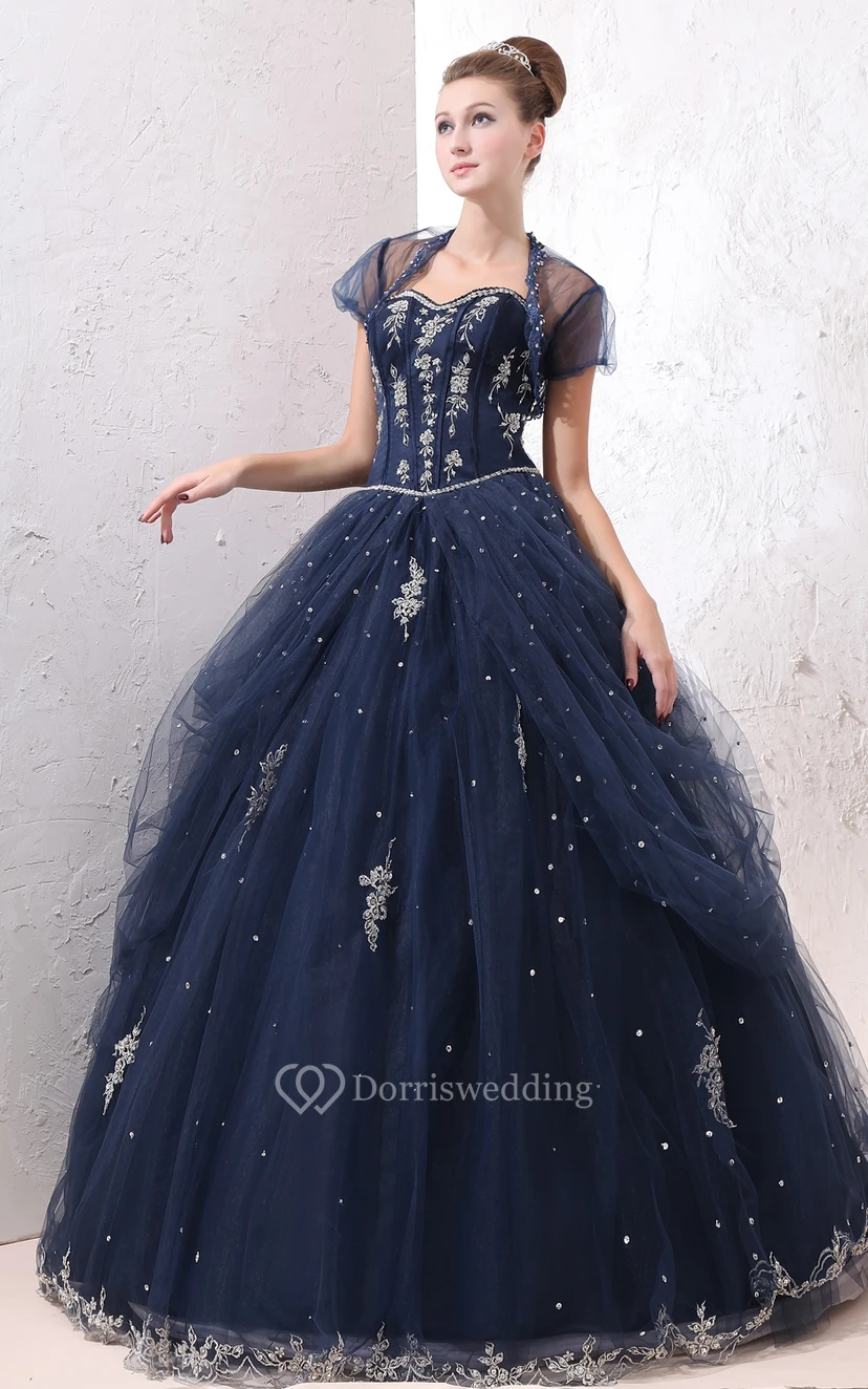 Exquisito vestido de gala de corte A con superposición de tul y apliques de encaje.