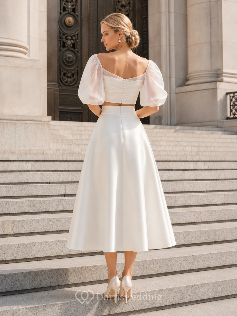 Conjunto nupcial de organza con top corto de manga abullonada y largo hasta la rodilla, estilo juzgado. view 2