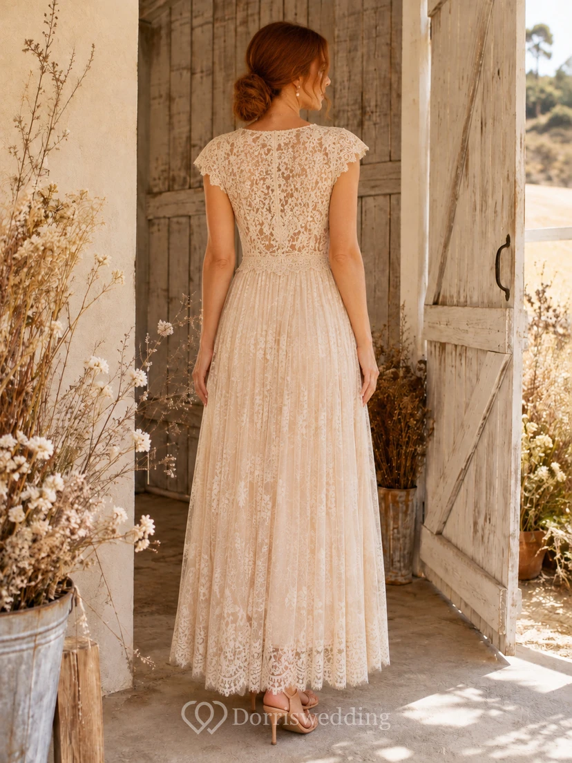 Vestido de novia bohemio color champán con escote en V, mangas cortas, fajín de encaje y corte en A hasta el tobillo. view 2