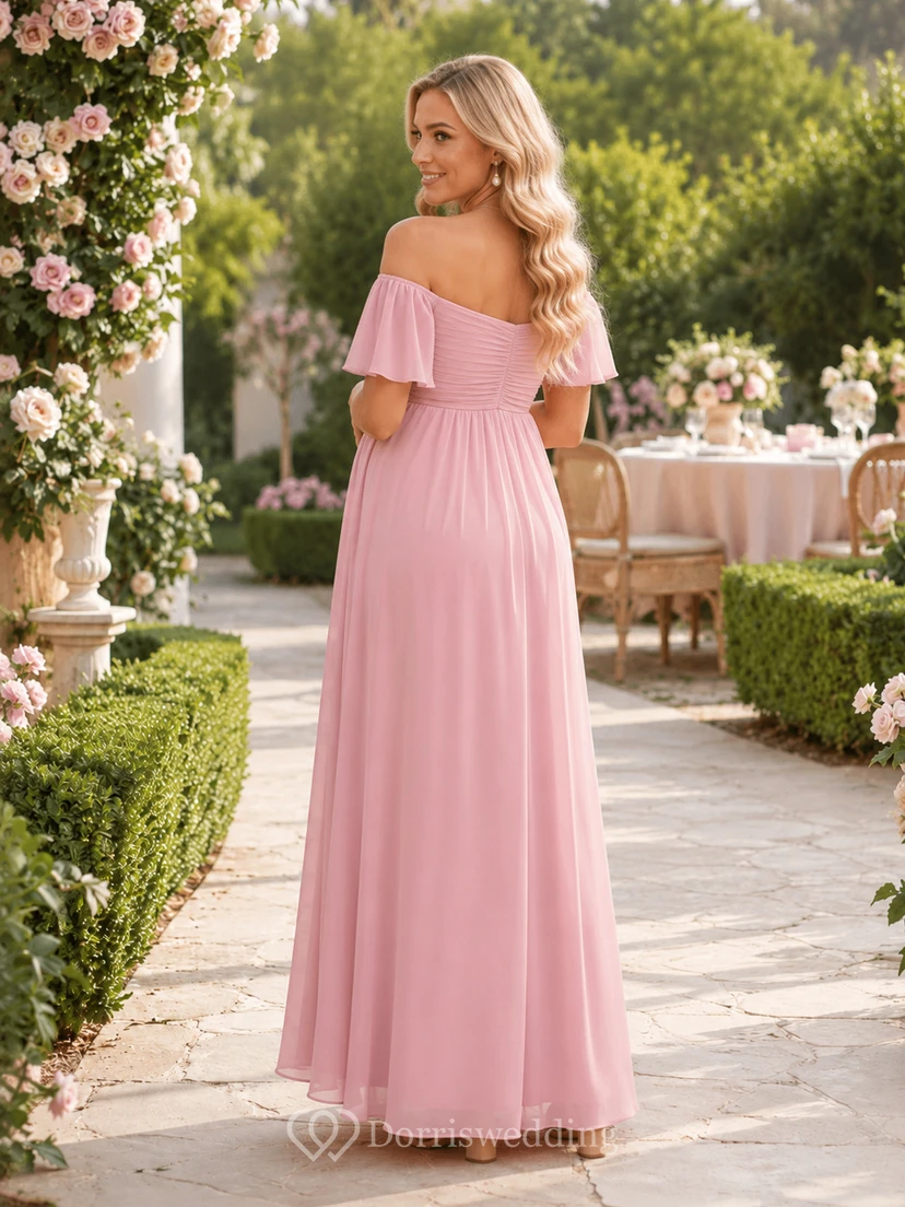 Robe de maternité rose poudré en mousseline rose poudré, épaules dénudées, manches papillon, style empire, longueur au sol, idéale pour une garden-party. view 2