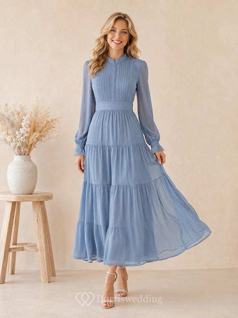 Vestido casual azul empolvado de manga larga, corte en A, escalonado y largo hasta los tobillos.