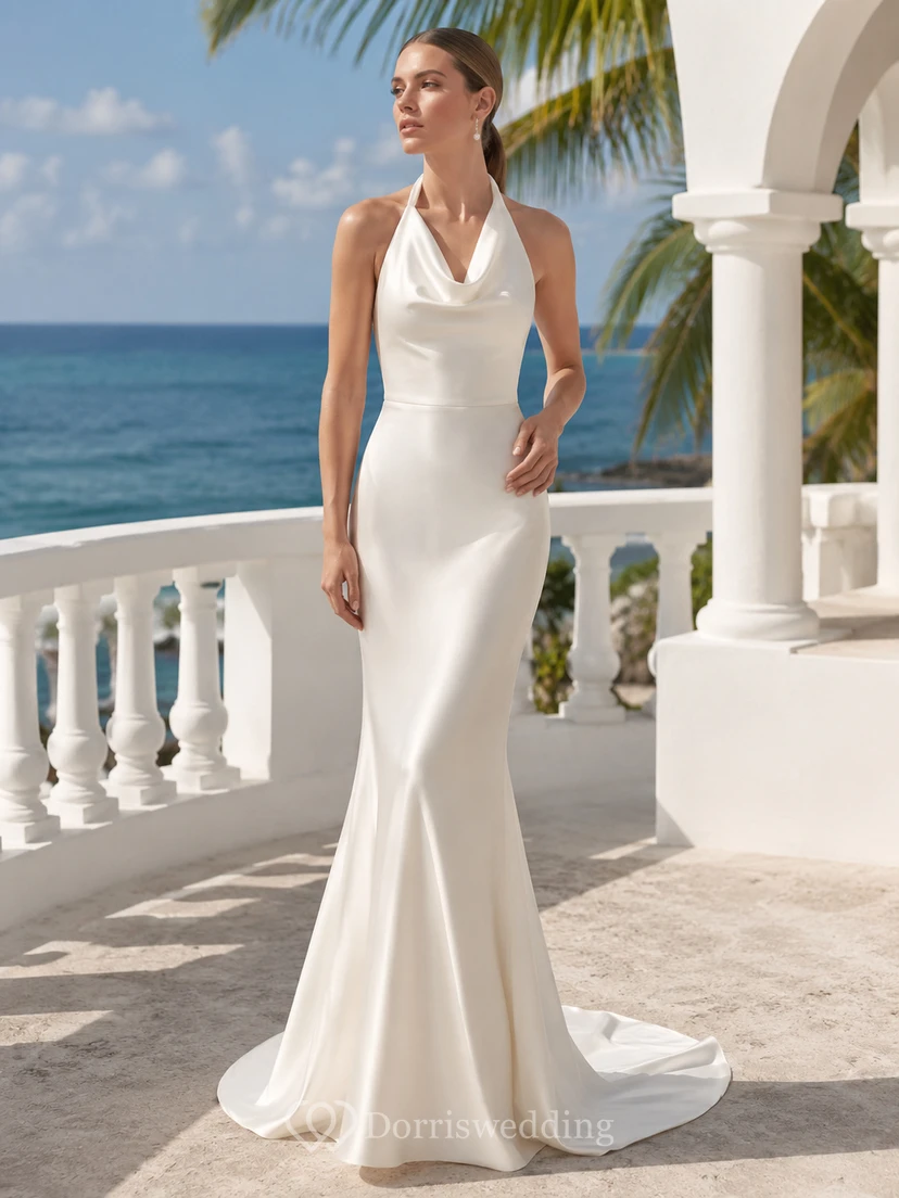 Robe de mariée minimaliste en satin, dos nu, traîne, col châle et jupe sirène.