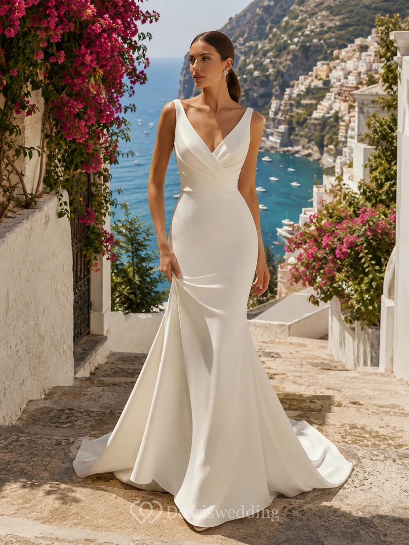 Robe de mariée sirène sexy en satin à bretelles en V et dos nu plongeant, idéale pour une destination romantique.