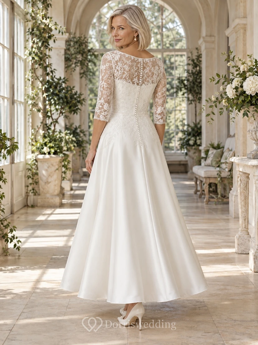 Vestido de novia de corte A, largo hasta el suelo, con escote perlado, mangas tres cuartos, corpiño de encaje y satén. view 2