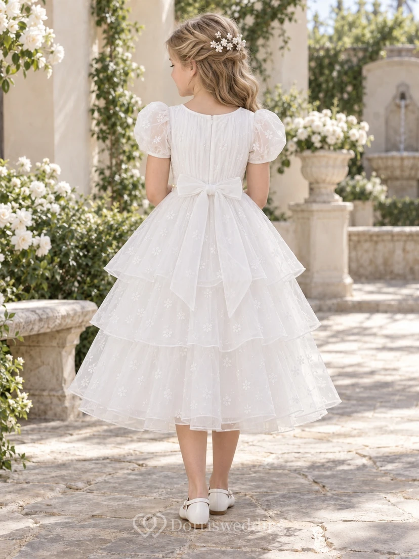 Vestido de niña de flores modesto, blanco, de corte A, de tul, con mangas abullonadas y pliegues, hasta la rodilla. view 2
