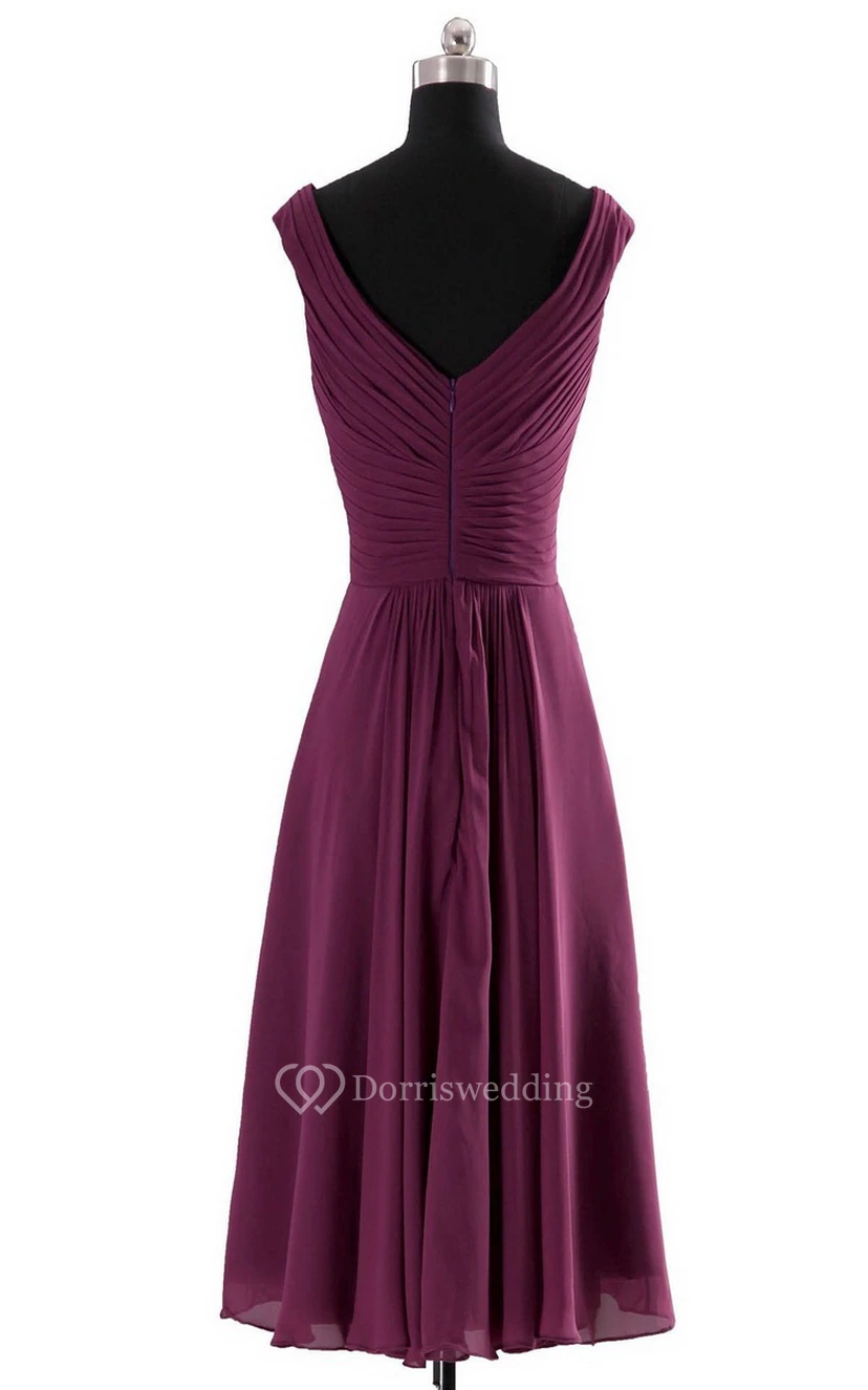 Vestido de gasa sin mangas con escote en V y corte imperio con volantes. view 5