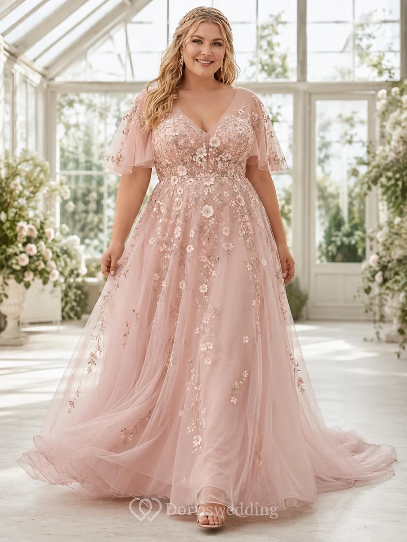Robe de mariée non traditionnelle grande taille rose poudré à col en V, manches cape fleuries et tulle, coupe trapèze.