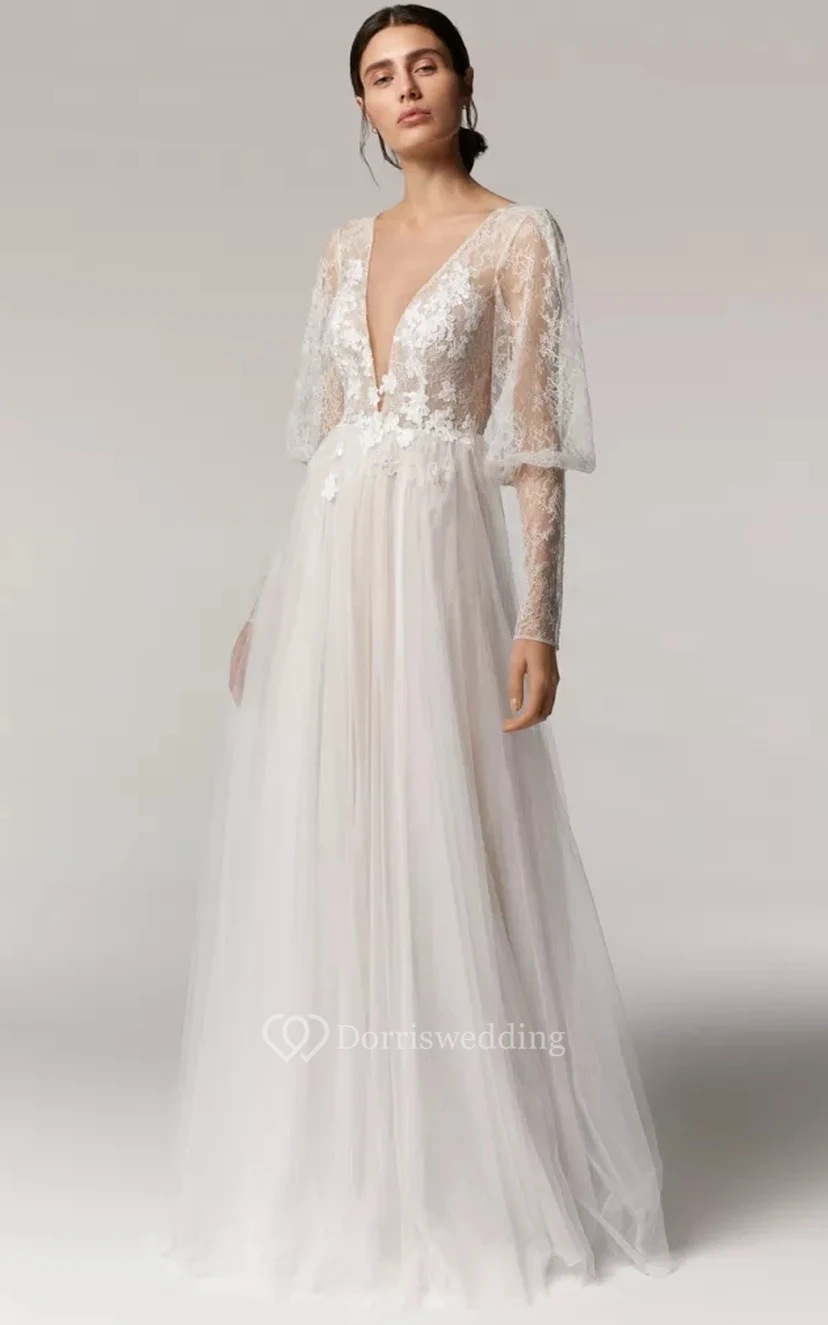 Vestido de novia bohemio de corte A con escote pronunciado, mangas largas abullonadas y falda de tul.