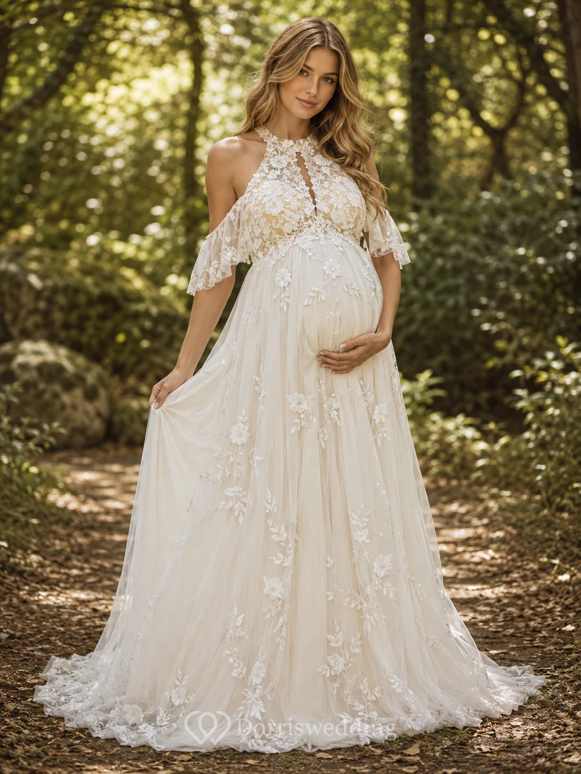 Vestido de novia premamá de corte A con escote halter, cuello alto y espalda descubierta de encaje.