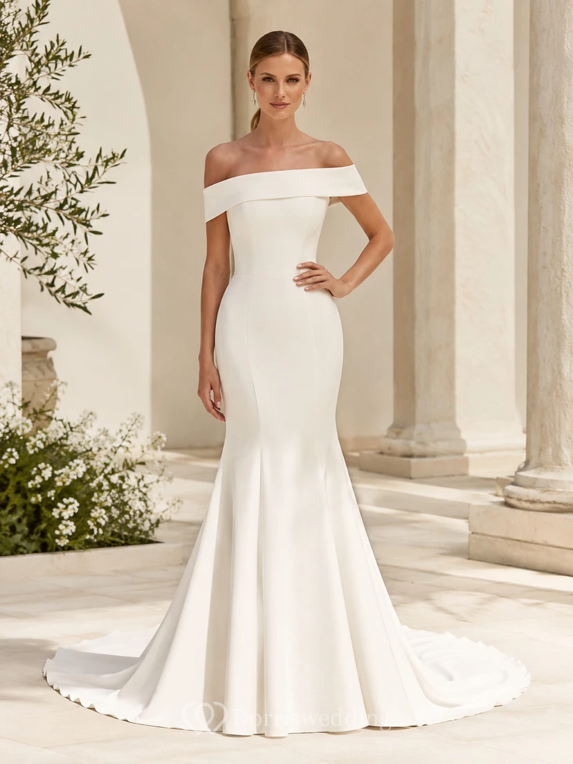 Vestido de novia moderno de satén con hombros descubiertos, corte sirena, manga corta, cola larga y botones en la espalda.