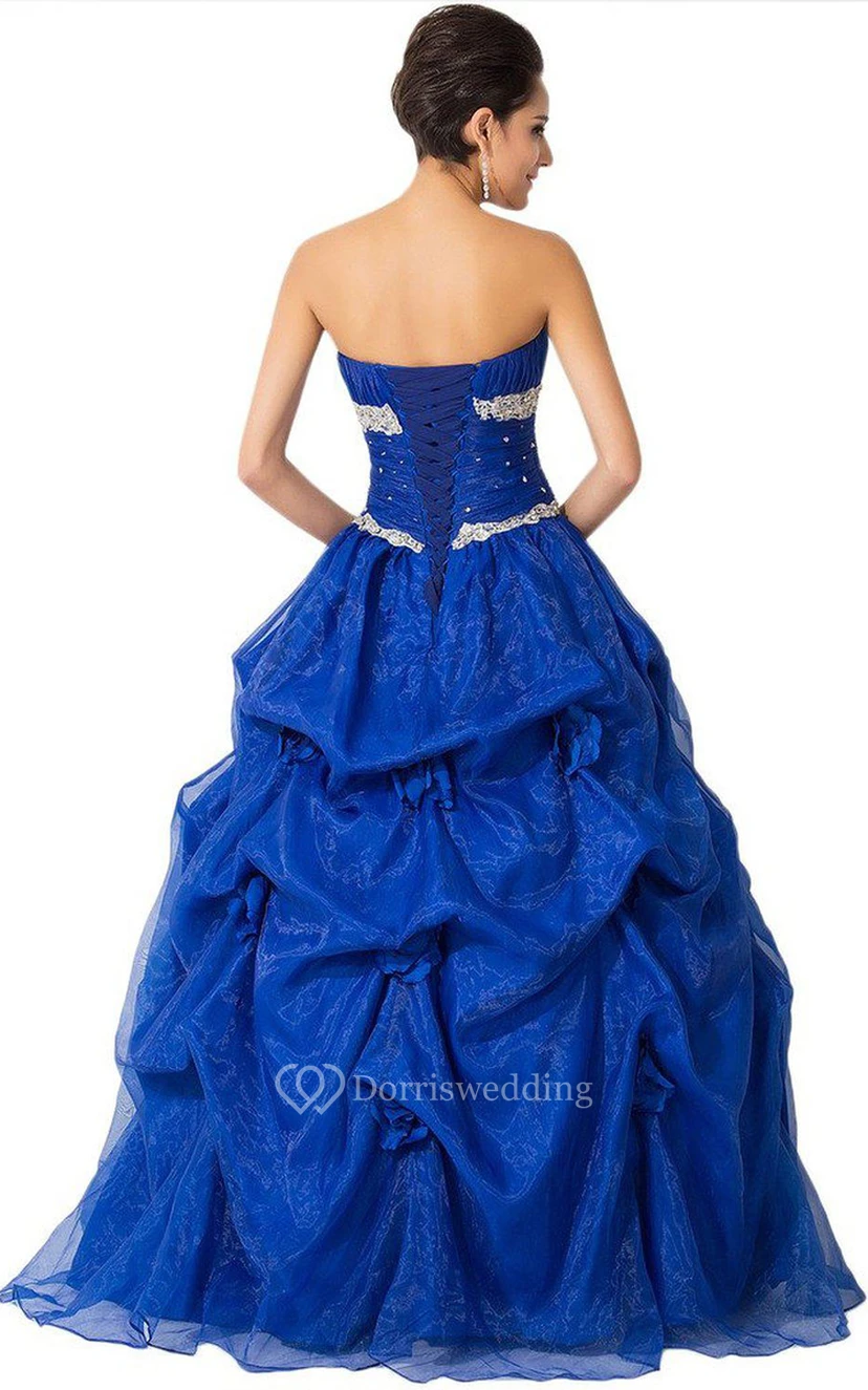 Vestido de gala sin tirantes con abalorios y volantes. view 2