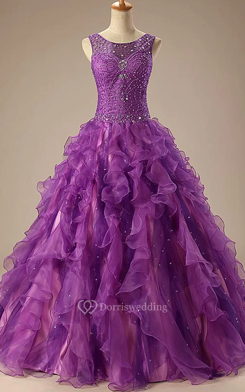 Vestido de gala largo hasta el suelo, sin mangas, con pedrería, corsé, encaje en la espalda, lentejuelas y organza satinada.