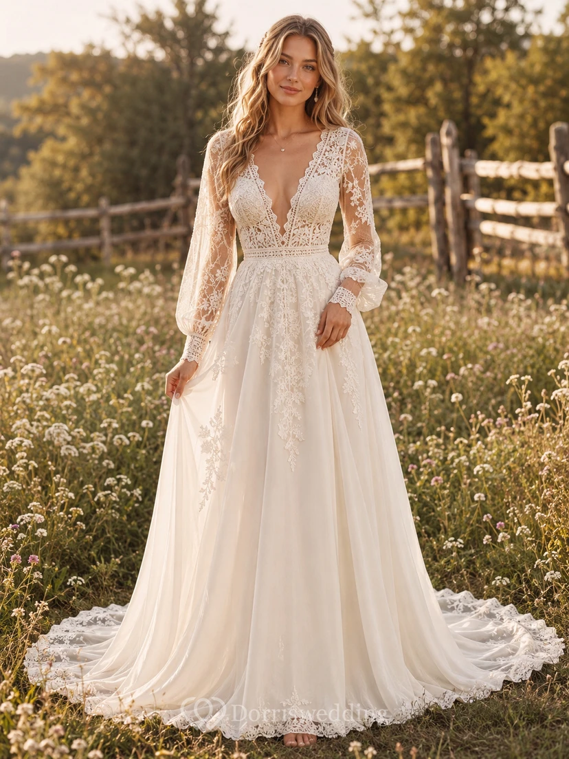 Vestido de novia bohemio de encaje y tul, corte en A, escote en V, manga larga y cola larga.