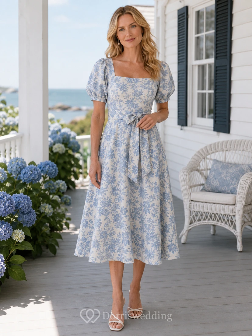 Vestido de lino azul con cuello cuadrado, mangas abullonadas y corte en A, ideal para invitadas a tomar el té.