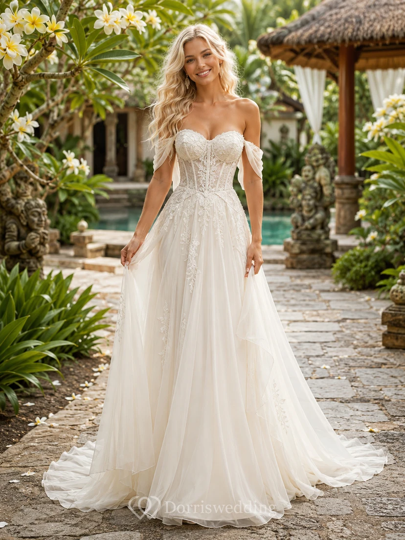 Robe de mariée romantique à épaules dénudées, décolleté cœur, dentelle et tulle, coupe trapèze, corset et traîne chapelle