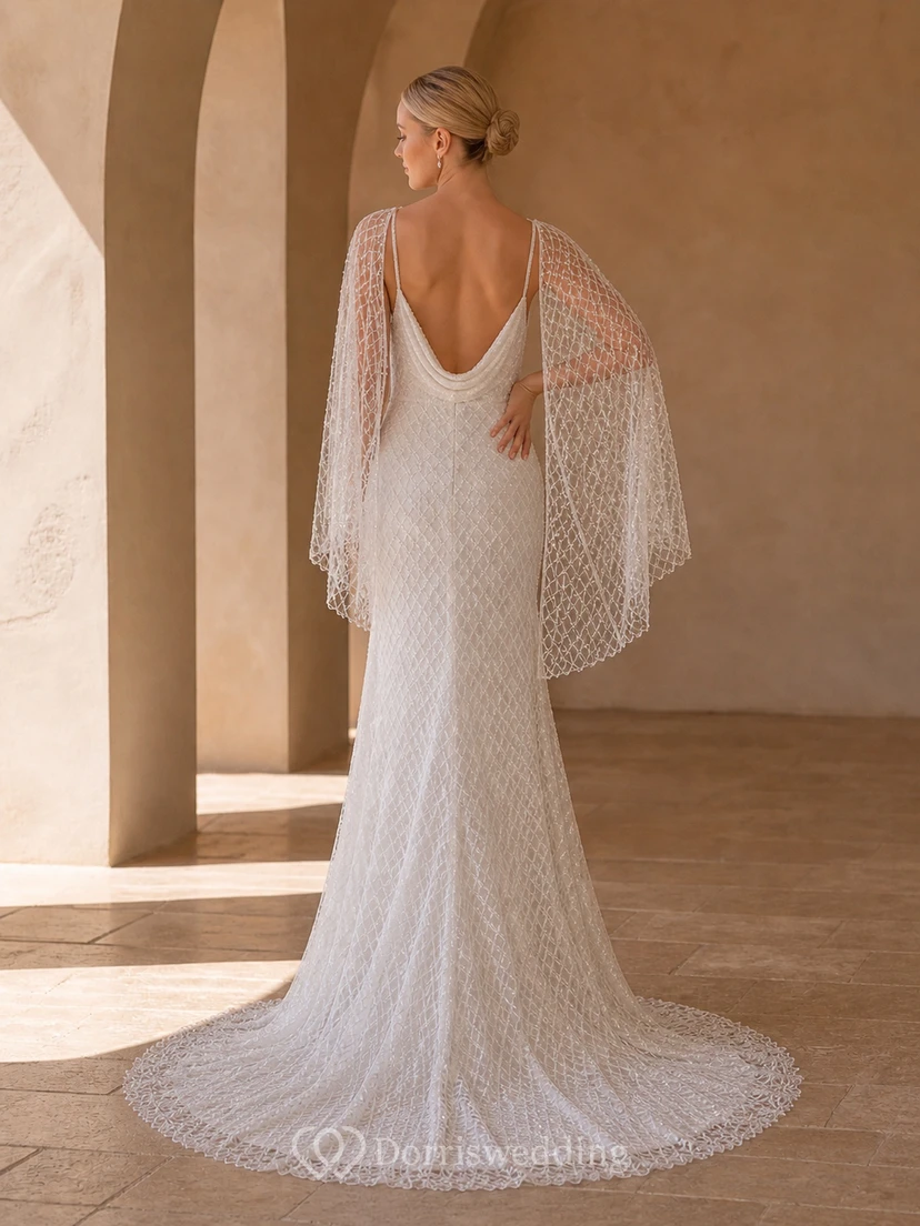 Vestido de novia bohemio de corte recto con mangas murciélago y escote drapeado, encaje geométrico y falda larga. view 2