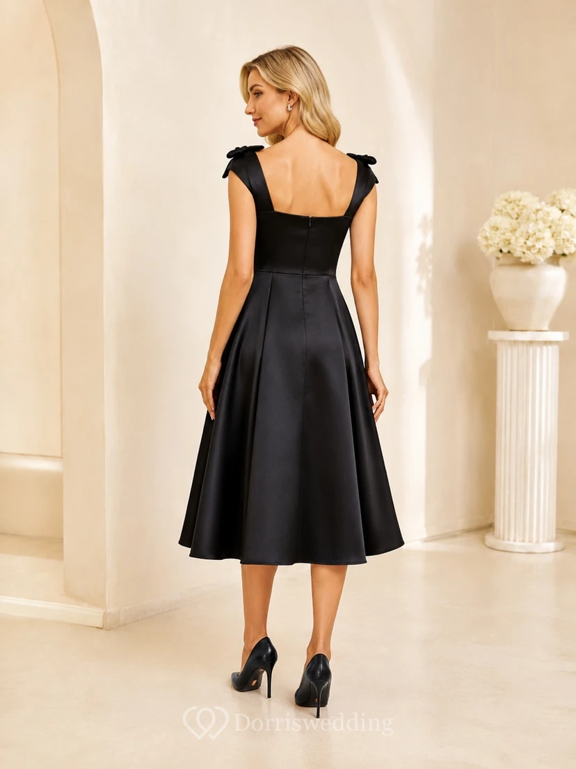 Robe cocktail noire satinée à encolure carrée et bretelles à nœud, sans manches, coupe trapèze, longueur thé view 2