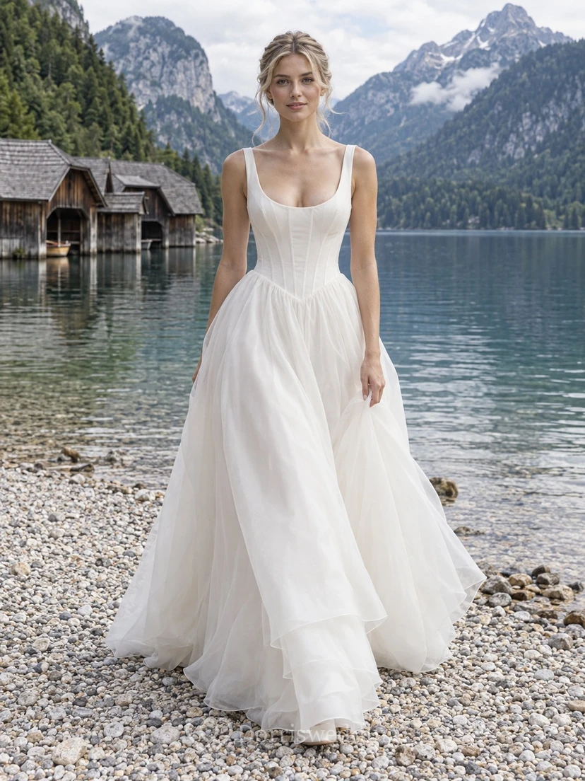Vestido de novia sencillo de organza con escote redondo, corte en A, sin mangas y cola.