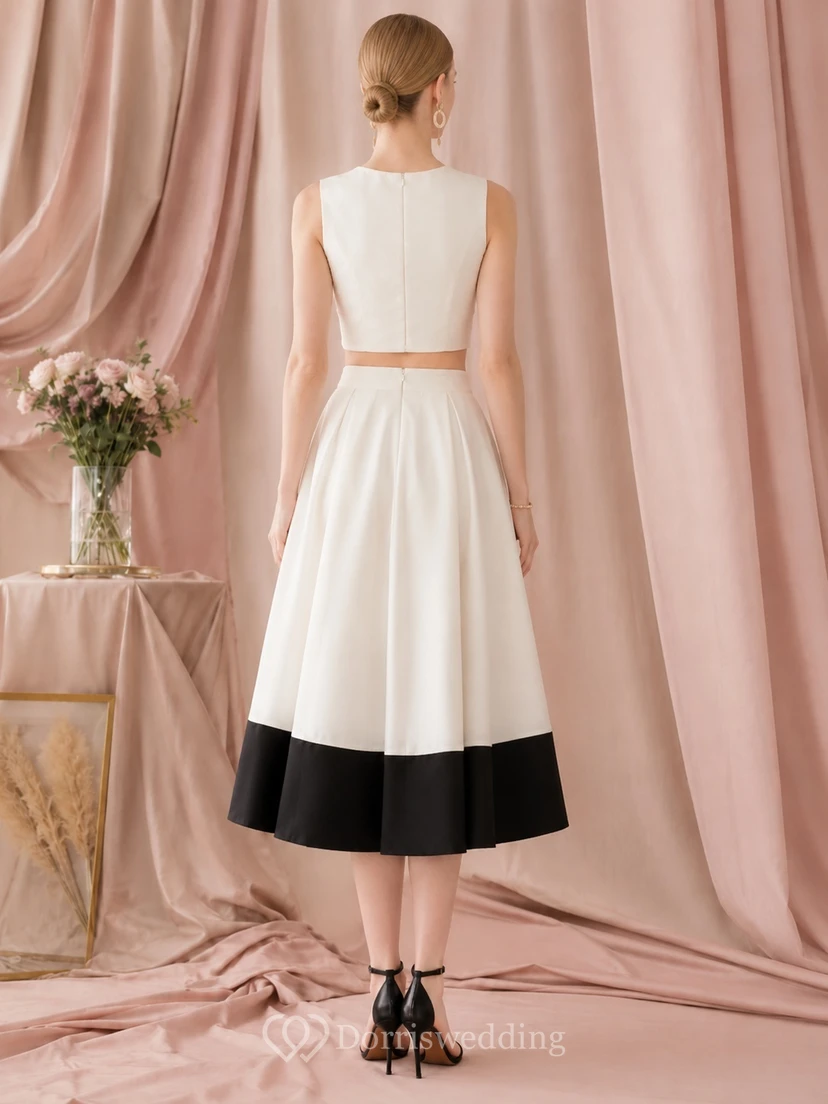 Vestido formal moderno de dos piezas en blanco y negro, sin mangas, de satén, largo hasta la rodilla, para invitadas. view 2