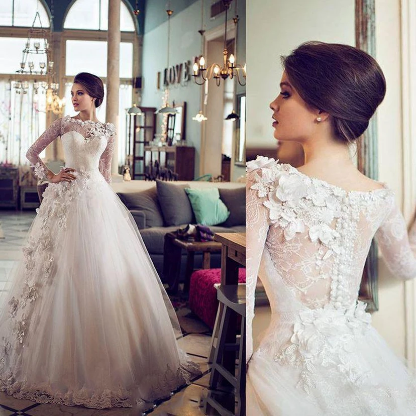 Elegante vestido de novia vintage de tul con mangas largas estilo barco y encaje floral. view 2