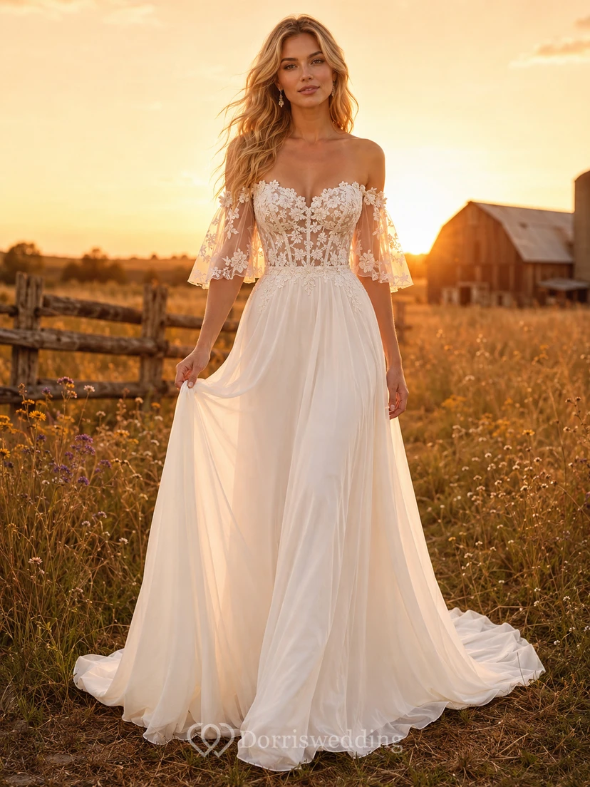 Robe de mariée champêtre en tulle, coupe trapèze, épaules dénudées, manches bouffantes, traîne chapelle, dos corset lacé