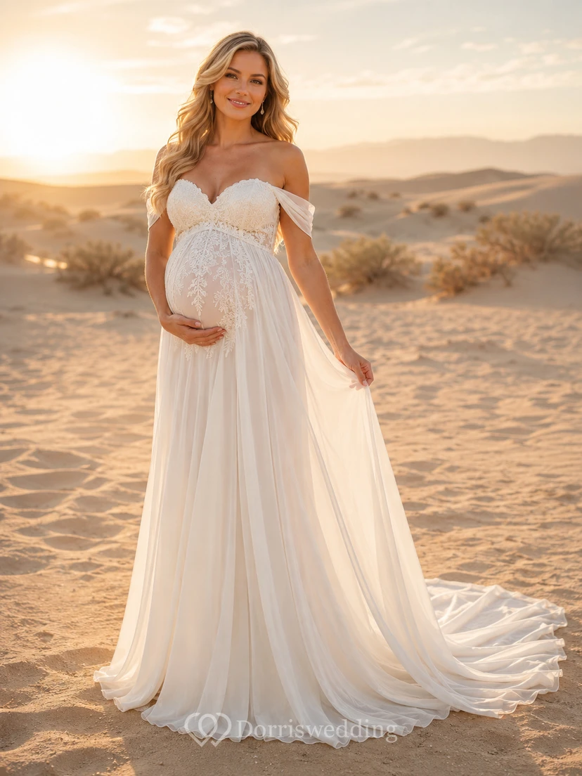 Vestido de novia premamá con corpiño de encaje y hombros descubiertos, estilo desértico, con cola larga.