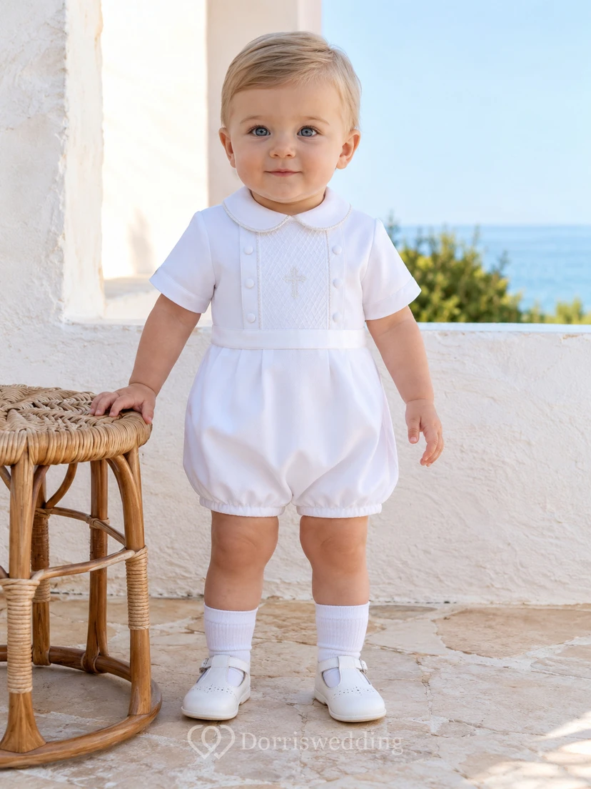 Pelele de bautizo tipo burbuja con cuello Peter y cruz bordada en blanco para bebé niño