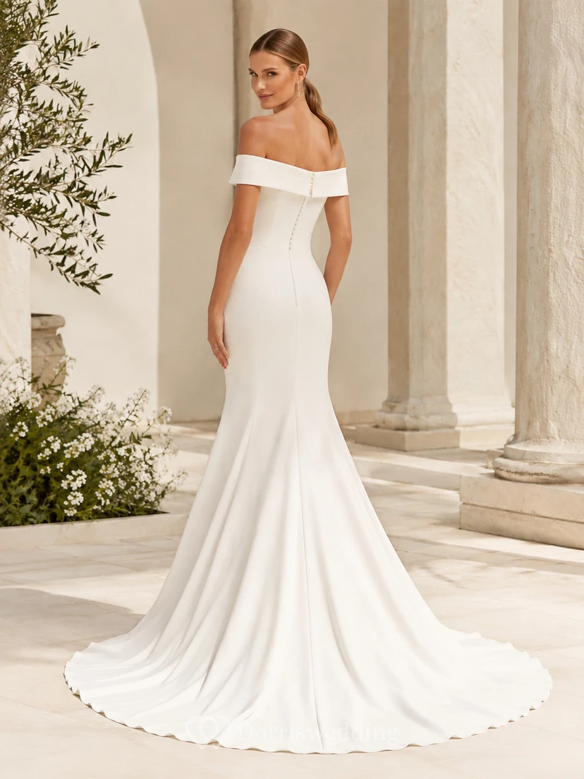 Vestido de novia moderno de satén con hombros descubiertos, corte sirena, manga corta, cola larga y botones en la espalda. view 2