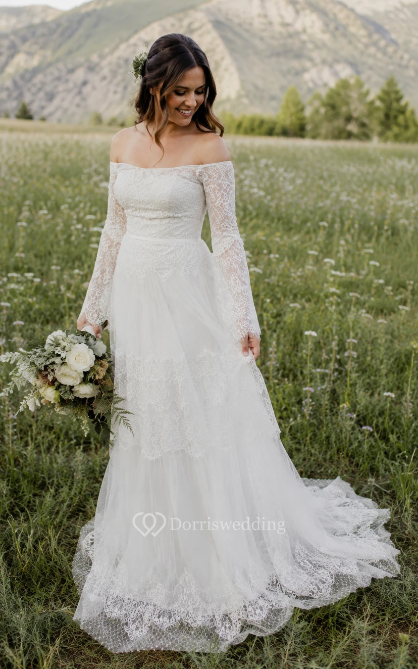 Robe de mariée ivoire à épaules dénudées, manches longues et dentelle à volants view 9