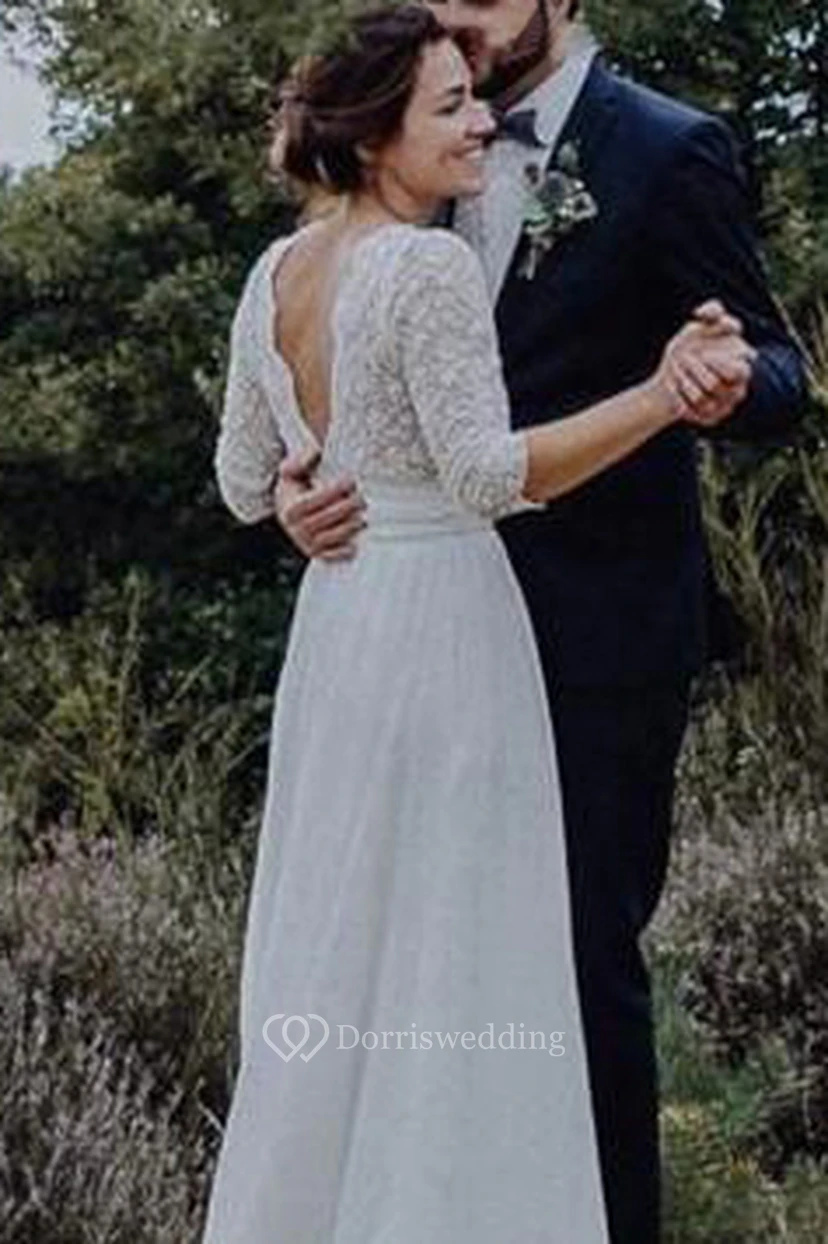 Robe de mariée vaporeuse en mousseline et dentelle, manches 3/4 festonnées et froncées view 2