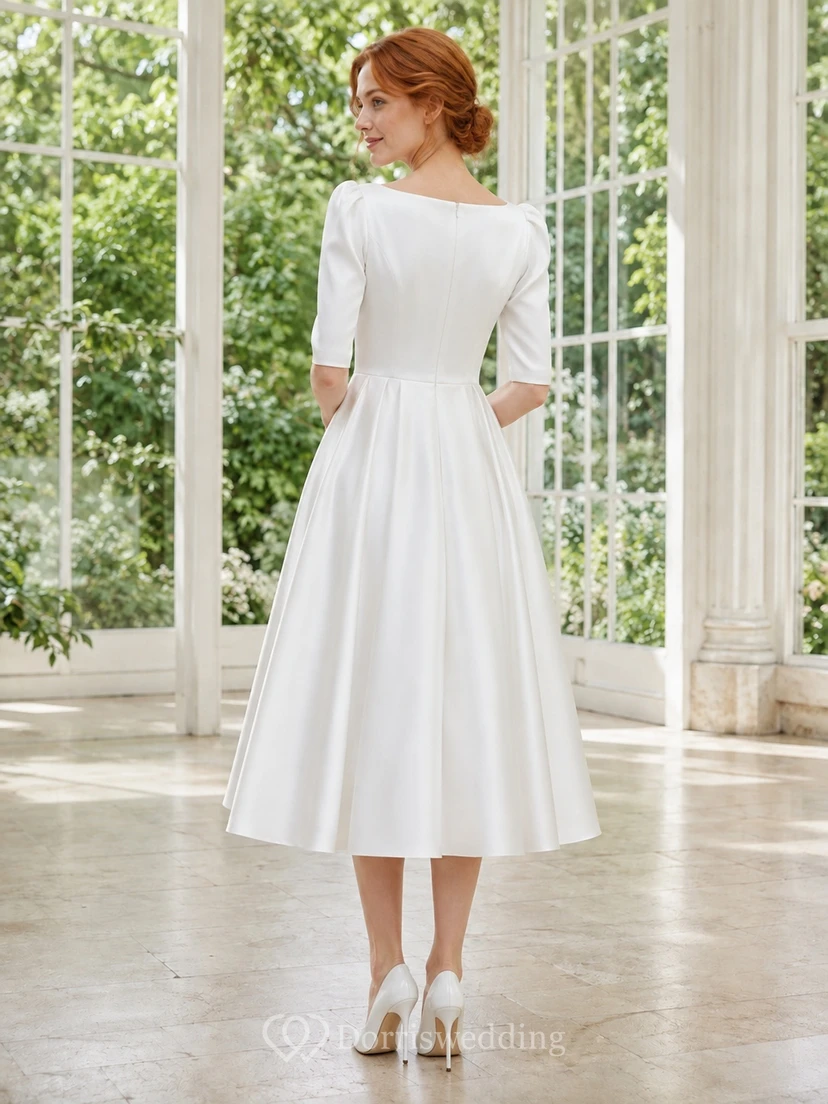 Weißes, plissiertes A-Linien-Kleid aus Satin mit U-Boot-Ausschnitt, halben Ärmeln und Teelänge – schlicht und elegant view 2