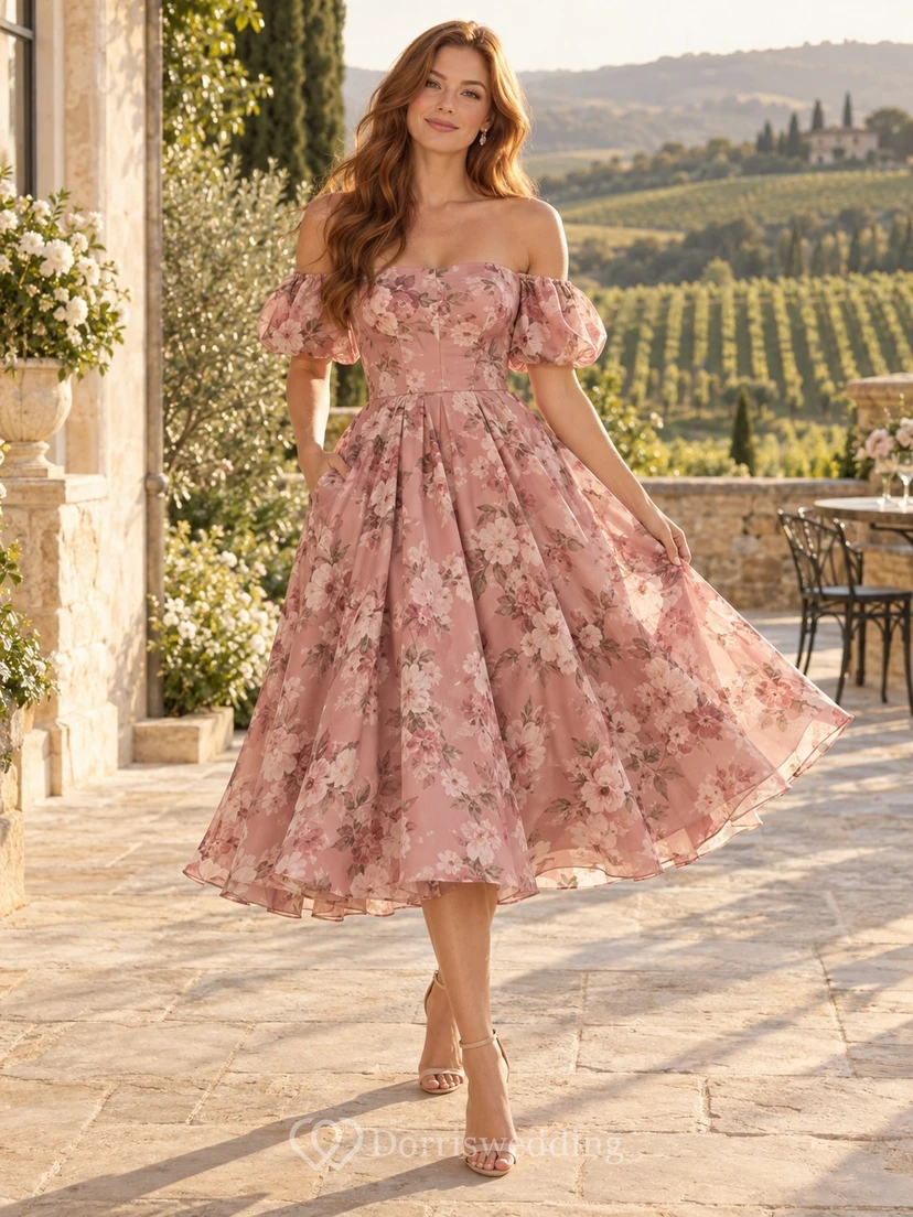 Vestido de gasa de largo midi con estampado floral rosa empolvado, hombros descubiertos y mangas abullonadas, ideal para invitadas.