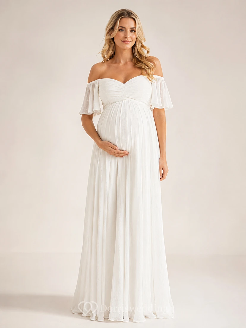 Robe de mariée de maternité style empire, longue jusqu'au sol, épaules dénudées, manches courtes, en mousseline, romantique et élégante, idéale pour un jardin.