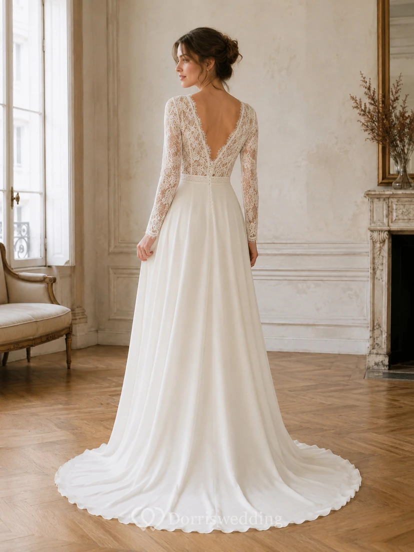Robe de mariée raffinée en mousseline de soie et dentelle, décolleté en V profond, manches longues, coupe trapèze, traîne, dos nu plongeant, manches longues et bustier en V. view 2