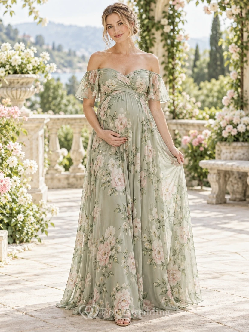 Vestido de dama de honor de gasa de corte imperio, largo hasta el suelo, color verde salvia con estampado floral, hombros descubiertos y mangas cortas.