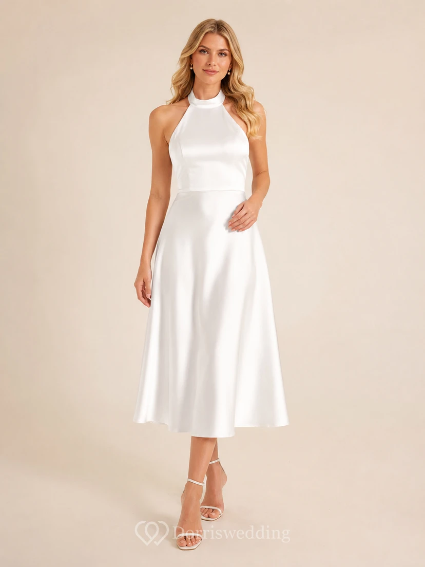Vestido de fiesta vintage blanco sin mangas de satén con escote halter y corte en A, largo hasta la rodilla.