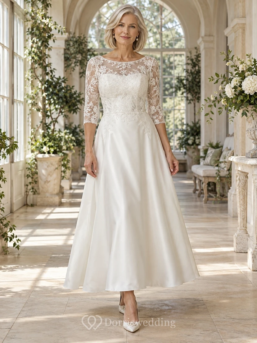 Vestido de novia de corte A, largo hasta el suelo, con escote perlado, mangas tres cuartos, corpiño de encaje y satén.