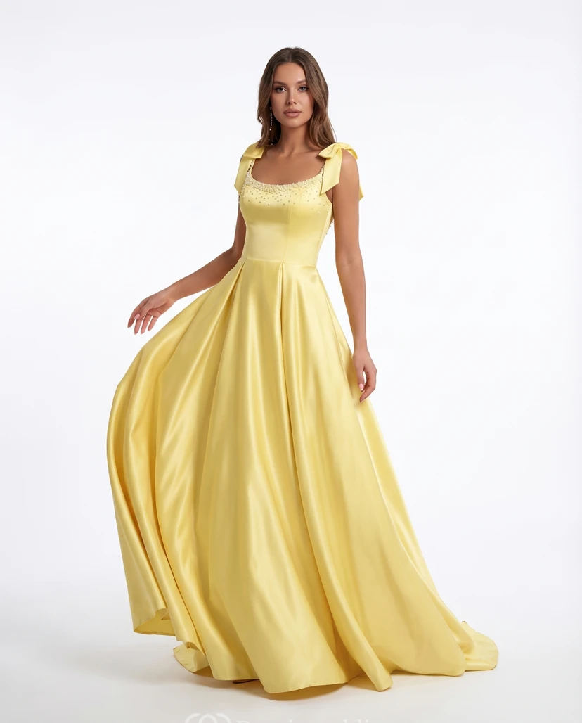 Robe de bal trapèze en satin jonquille avec bretelles à nœud et corsage perlé