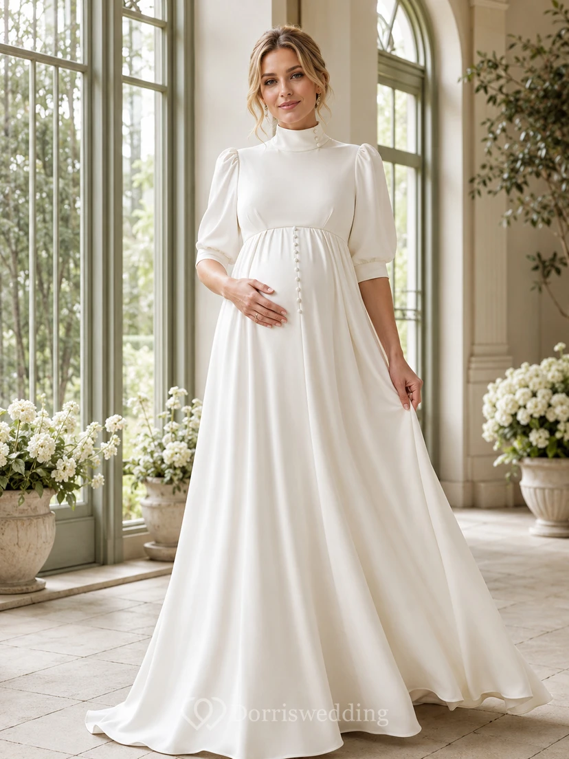 Robe de mariée moderne et pudique de maternité, col montant, manches bouffantes mi-longues, en satin, coupe empire, longueur au sol