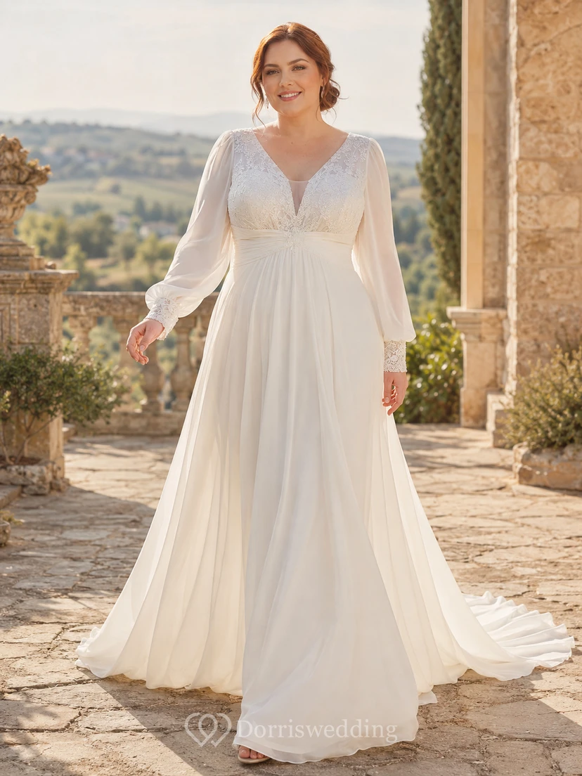 Robe de mariée minimaliste en mousseline, coupe trapèze, col en V, manches longues et traîne.