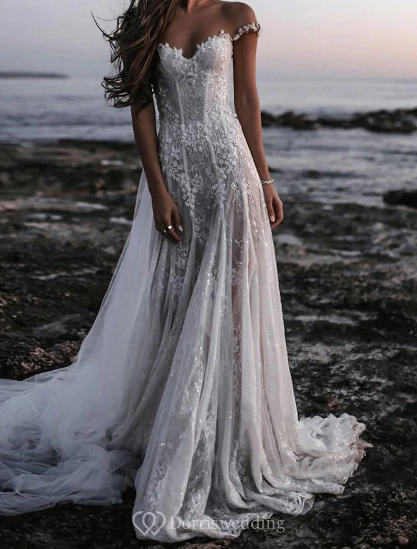 Vestido de novia de encaje con hombros descubiertos y falda de tul
