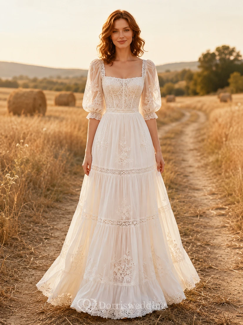 Robe de mariée champêtre en dentelle, coupe trapèze, col carré, manches courtes et traîne.