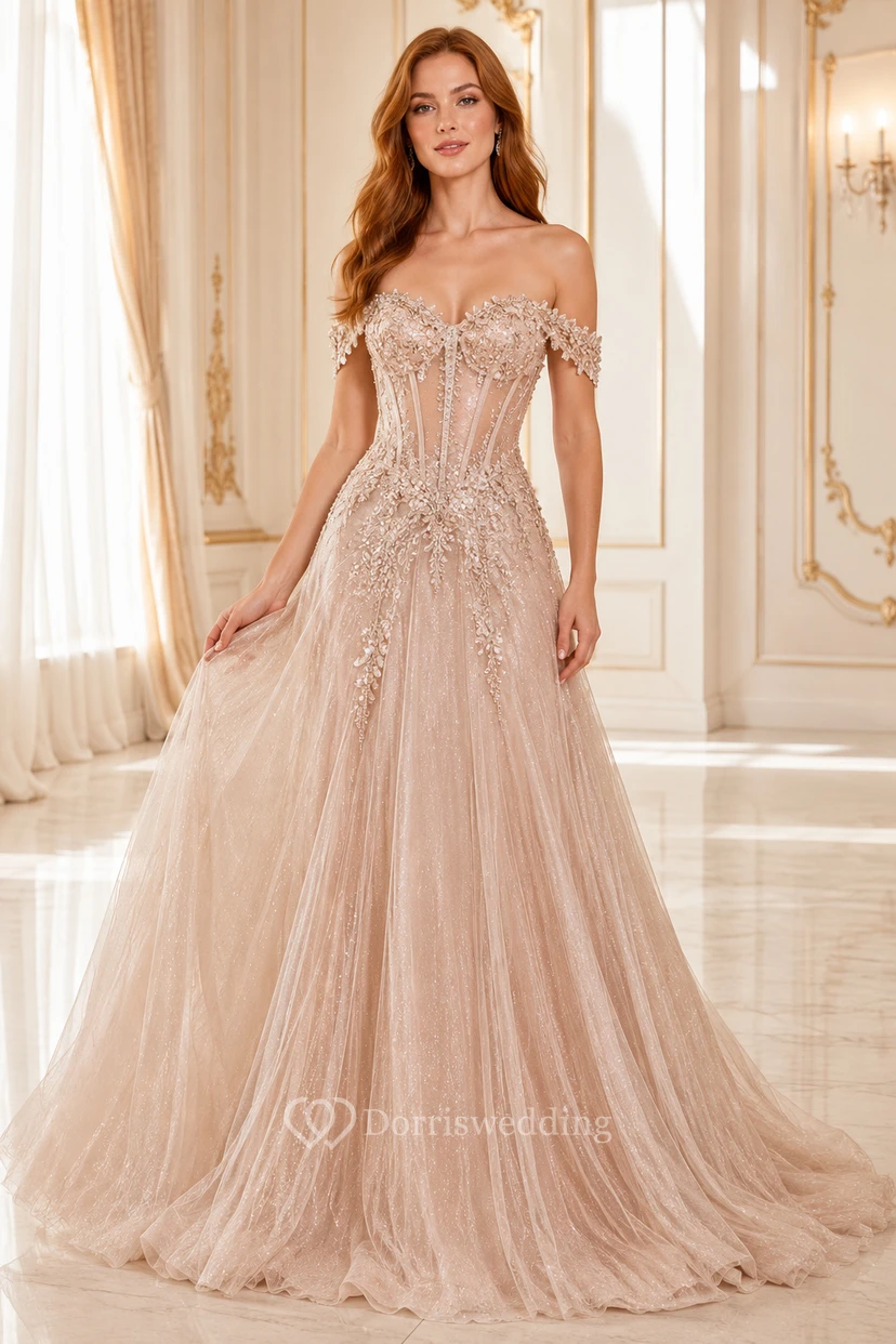 Vestido de fiesta de corte A de tul color champán con hombros descubiertos y corpiño con apliques de encaje.