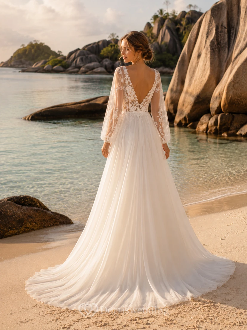 Robe de mariée bohème en mousseline à décolleté plongeant et manches bouffantes longues, coupe trapèze, idéale pour une escapade à la plage view 2