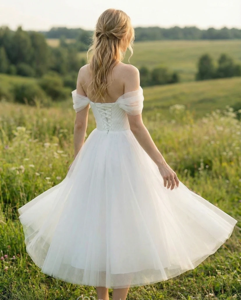 Vestido de novia de tul de largo midi con hombros descubiertos y escote corazón. view 2