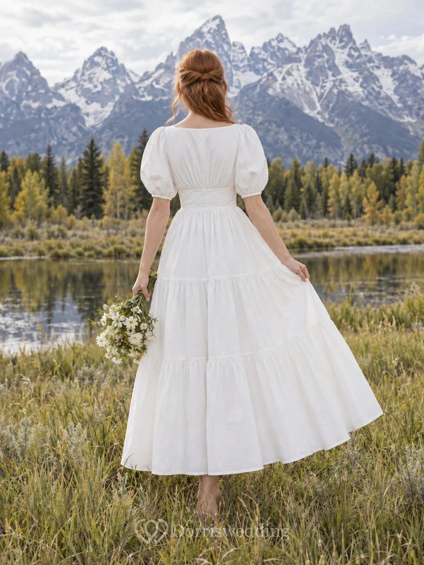 Vestido de novia sencillo de popelina tejida con escote barco, manga corta y volantes, largo hasta la rodilla. view 2